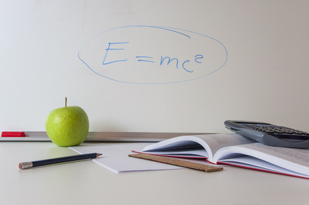 School supplies on white background. School tools, whiteboard, pencils, books and free space for...