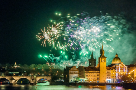Night photo of New Year Firework 2019 in Prague. Beautiful lightshow with Charles Bridge in background at the center of Pragueの写真素材