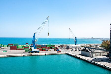 Bari, Italy, 24.4.2019: Big cargo port with cranes moving containers. Cargo dock in Italy.のeditorial素材