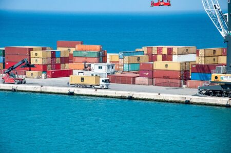 Bari, Italy, 24.4.2019: Big cargo port with cranes moving containers. Cargo dock in Italy.のeditorial素材