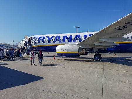 Prague, The Czech Republic, 22.4.2019: passengers boarding into plane. Low cost company Ryanair. Ryanair plane at the airport in Prague.のeditorial素材