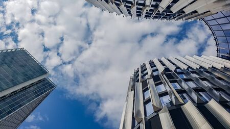 Closeup of skycraper business center. Glass business center with blue sky. windows of modern office centre.の写真素材