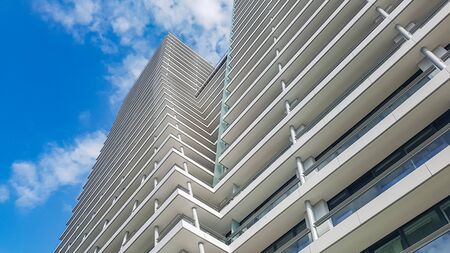 Closeup of skycraper business center. Glass business center with blue sky. windows of modern office centre.の写真素材