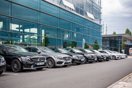Prague, The Czech Republic, 1.9.2019: Luxury Mercedes Benz cars parked in row in front of car dealership Mercedes Benz. View to row of parked cars.のeditorial素材