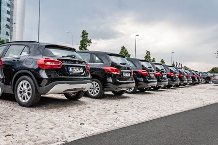 Prague, The Czech Republic, 1.9.2019: Luxury Mercedes Benz cars parked in row in front of car dealership Mercedes Benz. Rear view to row of parked cars.のeditorial素材