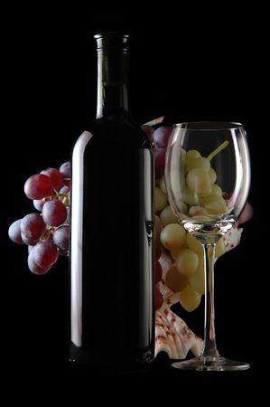 different grapes and glass of red wine on blackの写真素材