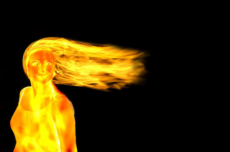 woman figure made of flames on blackの写真素材