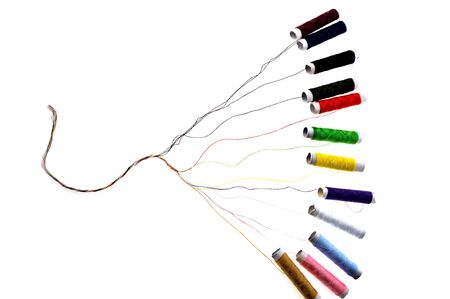 Colour threads for sewing lie on  surface