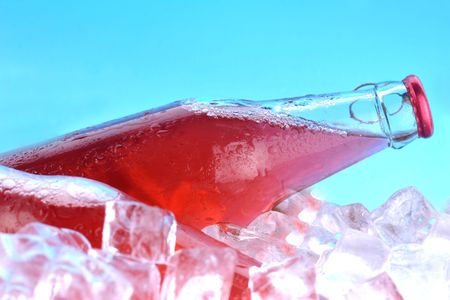 bottles with  tasty drink in iceの写真素材