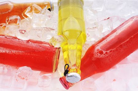 bottles with  tasty drink in iceの写真素材
