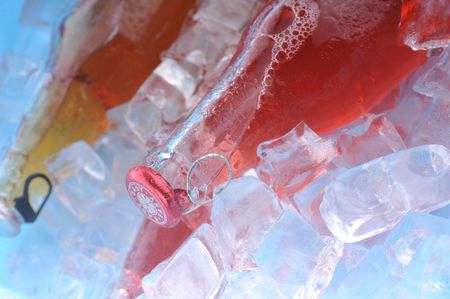 bottles with  tasty drink in iceの写真素材