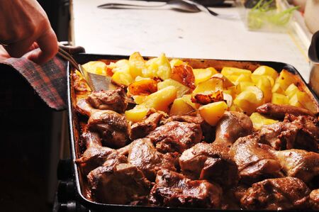 Tasty roast chicken with  potato close up