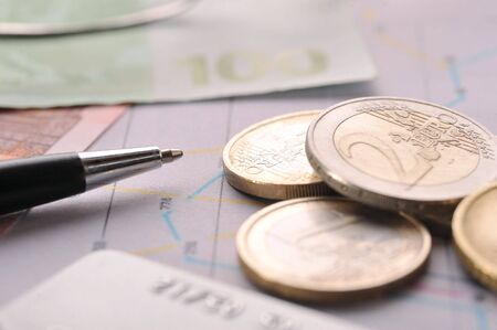 Credit cards,  black pen and money on table close upの写真素材