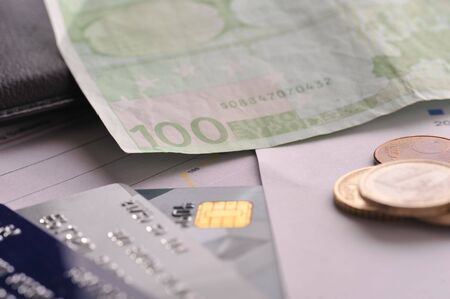 Credit cards and money on table close upの写真素材