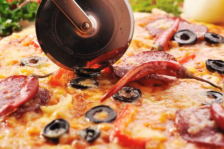 Close up of  pizza with tomatoes, cheese, black olives and  peppers.の写真素材