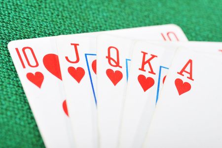 Poker winning hand over a vivid green background.