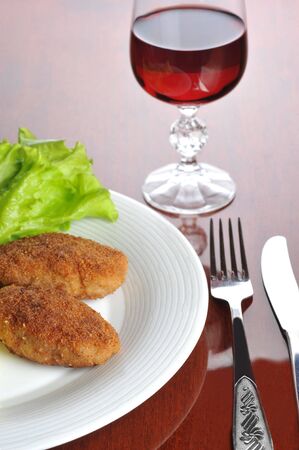 roasted cutlets of pork with potato and  wineの写真素材