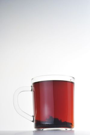 Full glass cup of tea isolatedの写真素材