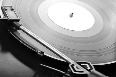 Vinyl record spinning on turntable close up