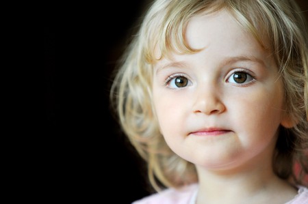 Portrait of lovely blond little girlの写真素材