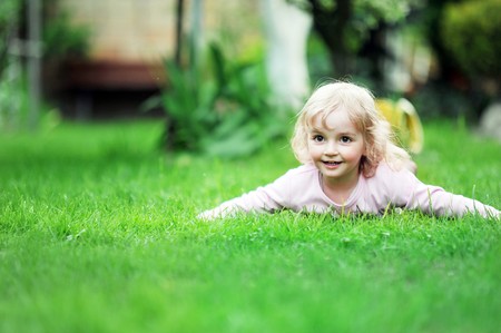 little girl relaxing on grassの写真素材