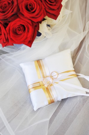 Garter, roses and wedding ringsの写真素材