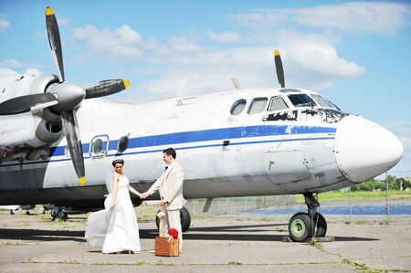 groom and bride fly to wedding travel by  planeの写真素材