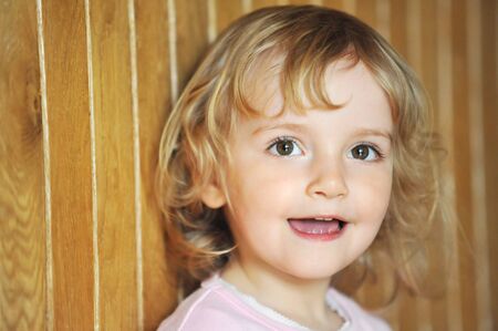 Portrait of lovely blond little girlの写真素材