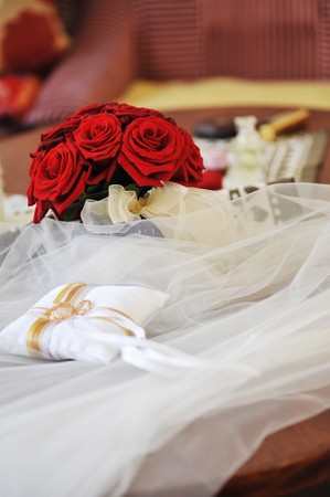 Garter, roses and wedding ringsの写真素材