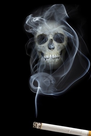 human scull appears in cigarette smokeの写真素材