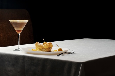  cold coffee - frappe  in a tall glass and sweet pastry