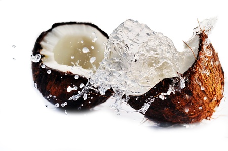 cracked coconut with big splashの写真素材