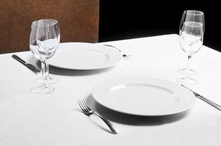 Tables set for  meal in  modern  restaurantの写真素材