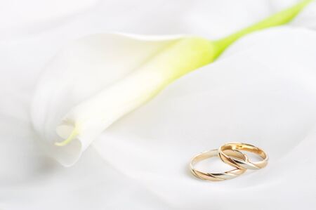 White transparent  fabric and wedding rings close upの写真素材