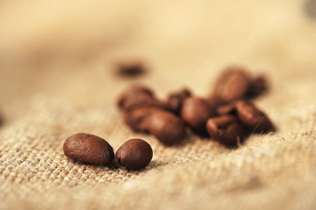 roasted coffee beans  on sacking, backgroundの写真素材