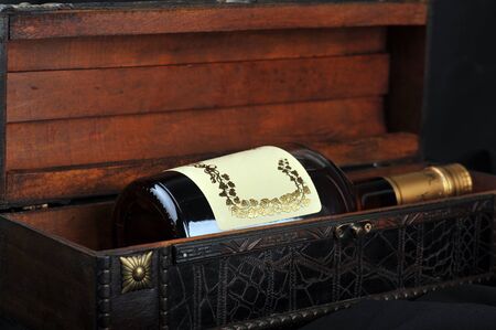 Cognac bottle in wooden case  backgroundの写真素材