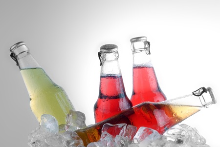 bottle with tasty drink in iceの写真素材