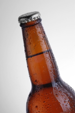 brown beer bottle  with condensationの写真素材