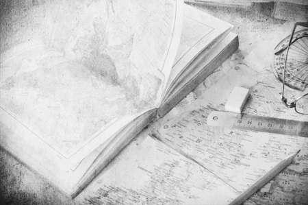  opened old atlas book on  map and  glassesの写真素材