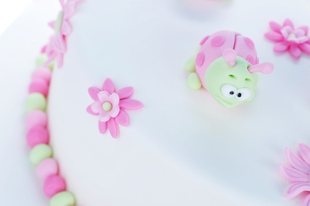 birthday cake with white frosting and ladybugsの写真素材