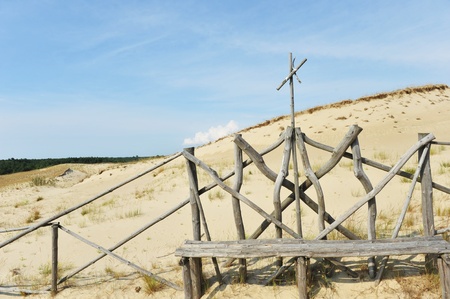 White clouds on blue sky over dunesの写真素材