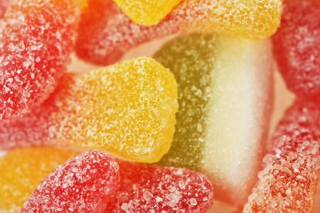 Different colorful candies jelly in sugar, backgroundの写真素材