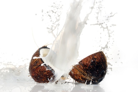 cracked coconut with big splash, isolated