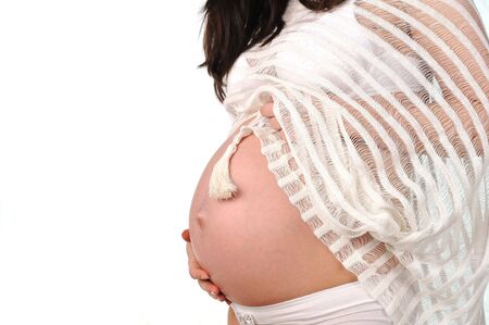 belly of young  pregnant woman.close up