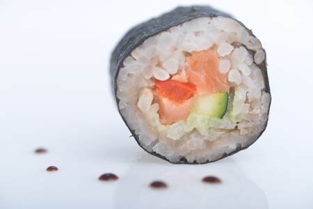  fresh sushi rolls and drop of sauce on  tableの写真素材
