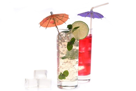  cocktail in wineglasses with lime, mint and umbrellaの写真素材