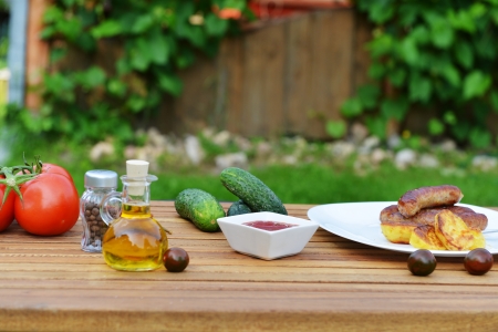tasty grilled meat sausages on dishの写真素材