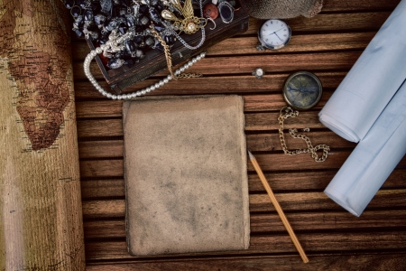 Wooden treasure chest with valuables and old map.の写真素材