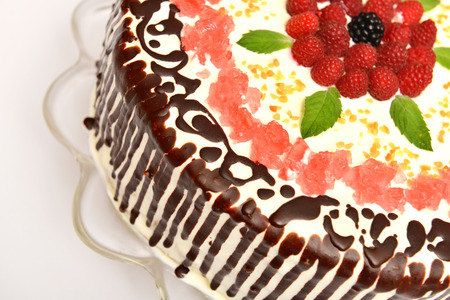 chocolate cake with cream, garnished slices of jelly and raspberryの写真素材