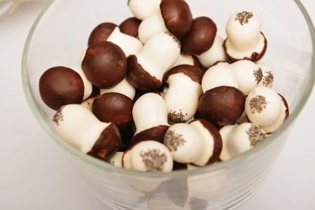 glass vase of mushroom cookies on table